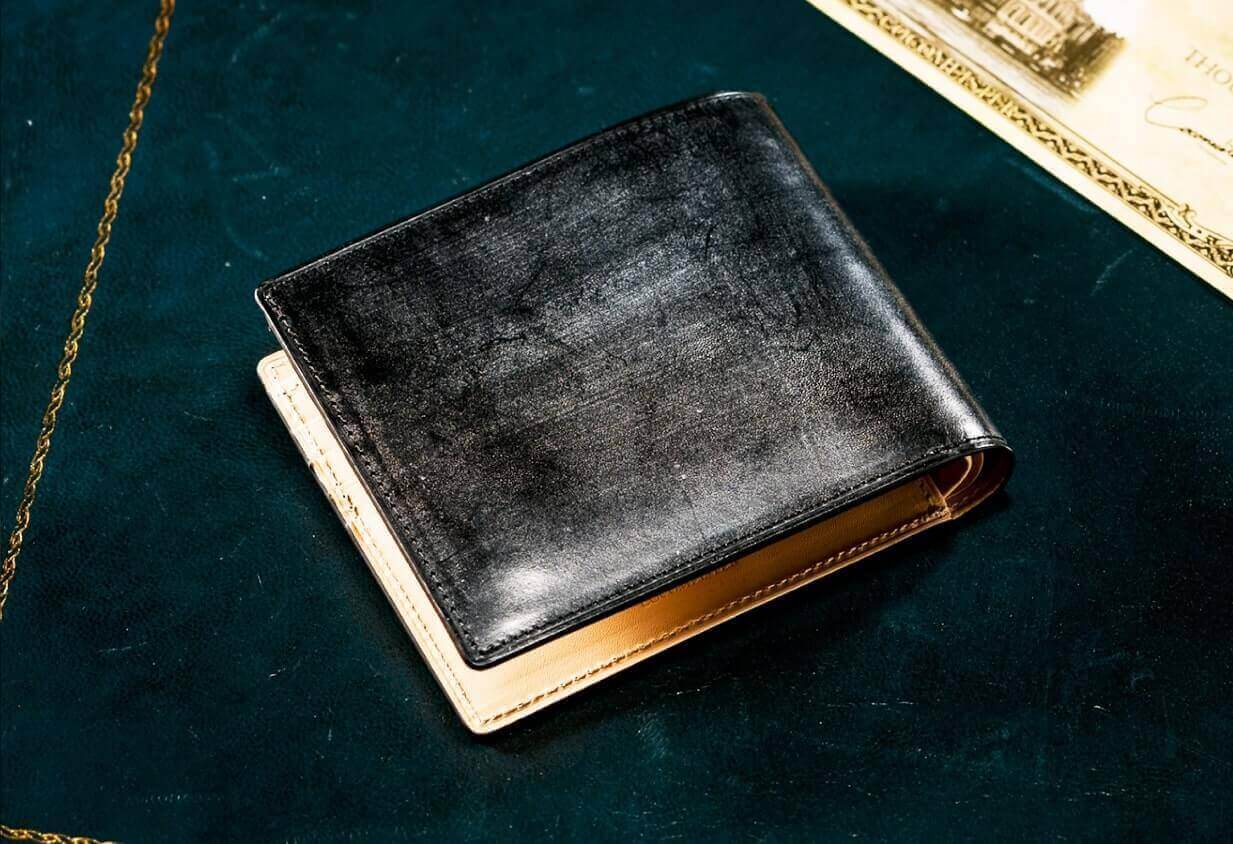 ココマイスターのブラックの二つ折り財布ブライドル　ブレンデルパース