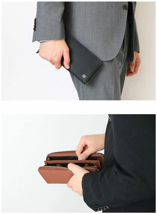 長財布を使うスーツ姿の男性